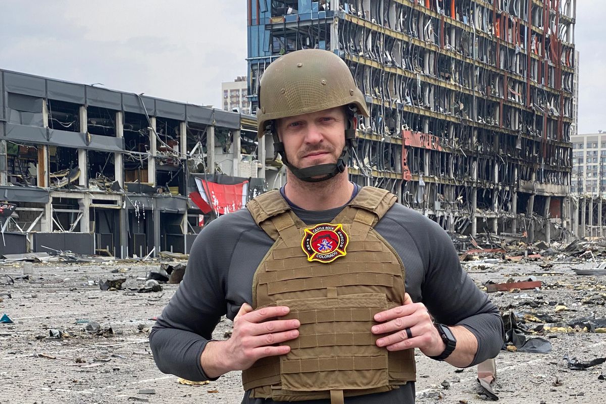 Jared Malone, of Post Falls, stands in front of a destroyed shopping center in Kyiv Ukraine on March 26, 2022. Eight people were killed there on March 21, 2022.   (Courtesy of Jared Malone)