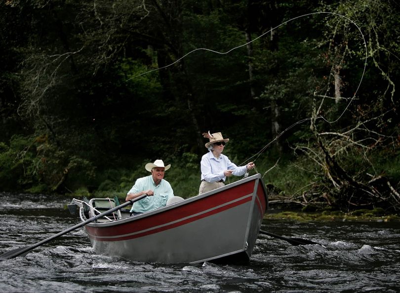 In this photo taken on Sept. 1, 2009, centenarian Dixie Monkhouse casts her fly on the waters of the McKenzie River in Eugene, Ore. with fishing guide Don Wouda. Monkhouse was the first female member of the Flyfisher's Club of Oregon. (Brian Davies / Associated Press)
