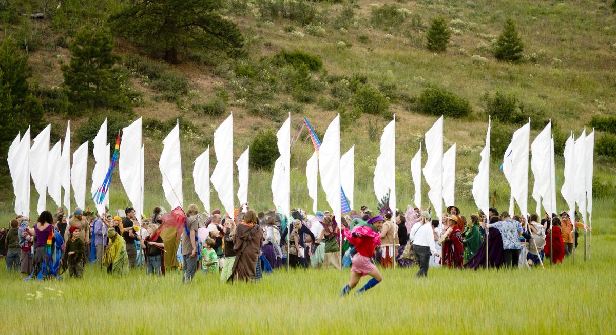During the fairy parade, participants sing and dance in a circle of prayer flags, where they believe fairy energy and magic  are strongest.  (Colin Mulvany / The Spokesman-Review)