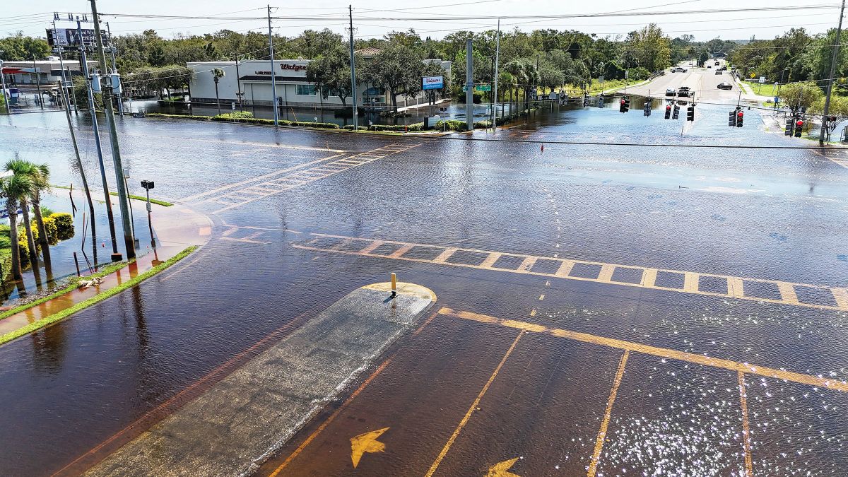 NEW PORT RICHEY, FLORIDA - OCTOBER 11: An aerial view of flooded roads and businesses by the rising Anclote River as the area tries to recover from Hurricane Milton on October 11, 2024 in New Port Richey, Florida. Milton arrived on Florida