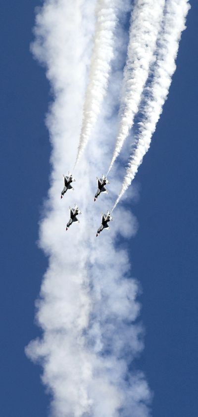  Four members of the U.S. Air Force Thunderbirds demonstration team rocket toward  Earth during their routine Saturday at SkyFest 2010 at Fairchild Air Force Base.  (Jesse Tinsley)