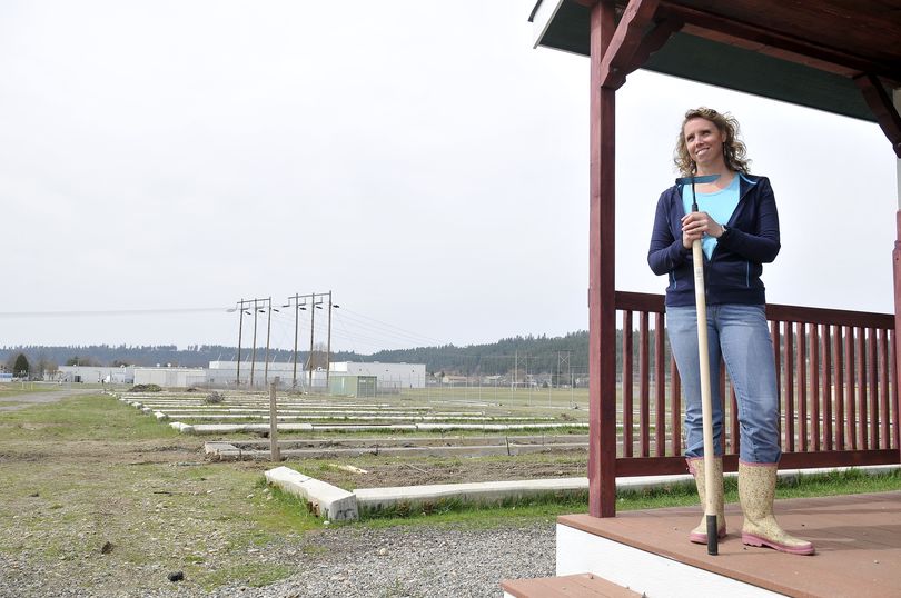 East Valley’s Farm to School project leader Lynette Romney stands on the porch of a shed at East Valley Farms on Tuesday. The project, which sits next to East Valley Middle School and East Valley High School, is on a Bonneville Power easement. The community garden is the work of service clubs, school kids, farmers and others who want to participate. (Jesse Tinsley)