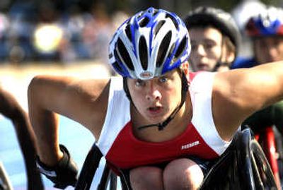 
Brian Siemann of Clarksburg, N.J., pushes his way to a 2-second victory Thursday during his heat of the 1,500-meter wheelchair race. 
 (Jed Conklin / The Spokesman-Review)