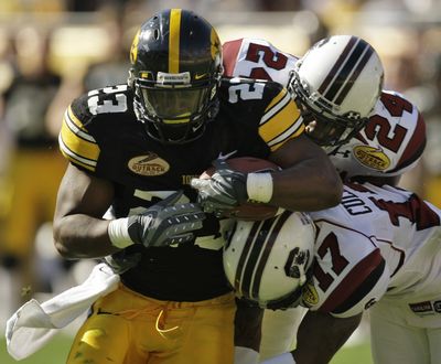 Shonn Greene scored 3 TDs in what he says is last game for Iowa.   (Associated Press / The Spokesman-Review)