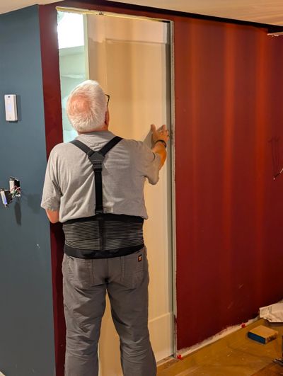 I'm checking a new pocket door in my son's basement to ensure it glides in and out of the pocket. There are many reasons you should consider several of these doors in your home.  (Tribune Content Agency)