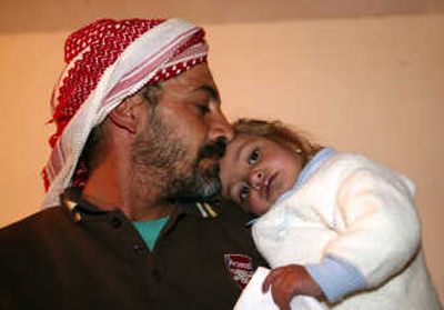 
Before meeting the Marines, Ala Thabit Fattah thought his daughter, Amenah, 2, would not live long. Los Angeles Times
 (Los Angeles Times / The Spokesman-Review)