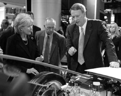 
U. S. Secretary of Transportation Mary Peters, left, is with GM Chairman and CEO Rick Wagoner, who on Friday announced that GM will offer transferable five-year, 100,000-mile powertrain warranty on some of its used vehicles.
 (Associated Press / The Spokesman-Review)