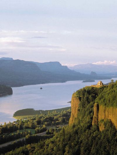 
The Vista House, right, top of cliff, is shown in the Columbia River Gorge. 
 (Associated Press / The Spokesman-Review)