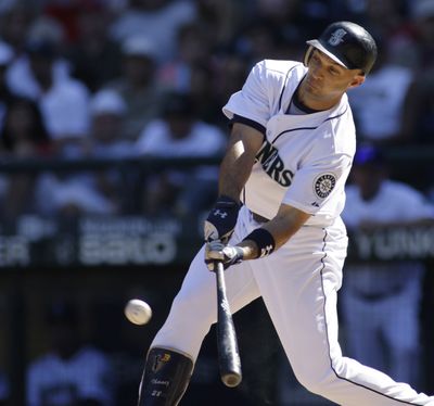 Seattle’s Raul Ibanez connects for an RBI double during the third inning.  (Associated Press / The Spokesman-Review)