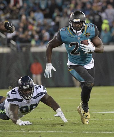 Jacksonville Jaguars running back Leonard Fournette gains yardage against the Seattle Seahawks in the Jaguars’ 30-24 victory on Sunday. (Phelan M. Ebenhack / Associated Press)