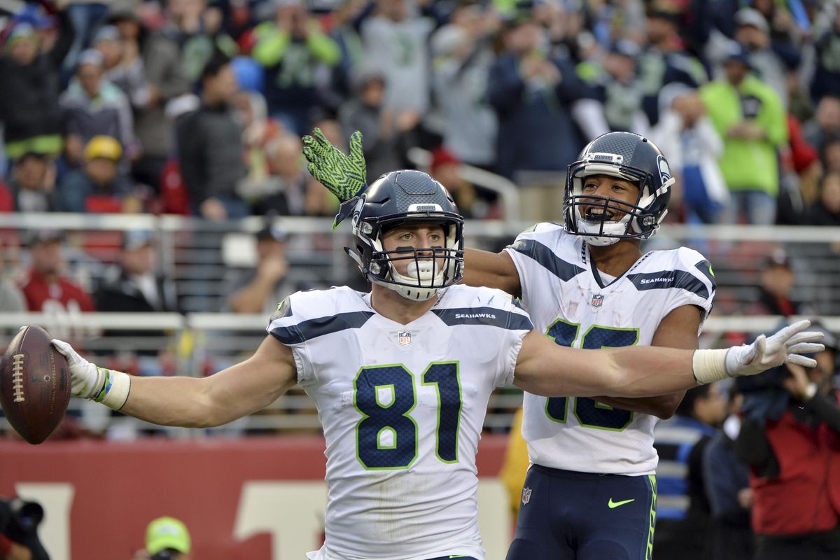 Seattle Seahawks tight end Nick Vannett (81) celebrate his touchdown reception with teammate Tyler Lockett during the second half of an NFL football game against the San Francisco 49ers Sunday, Nov. 26, 2017, in Santa Clara, Calif. (Don Feria / Associated Press)
