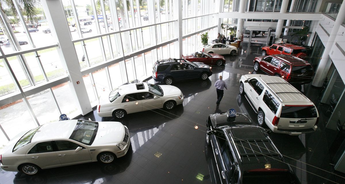 An employee walks through the showroom at the Williamson Cadillac dealership in Miami. General Motors Corp. said Tuesday that its May U.S. vehicle sales dropped 29 percent, but showed significant improvement from their April levels. (Associated Press / The Spokesman-Review)
