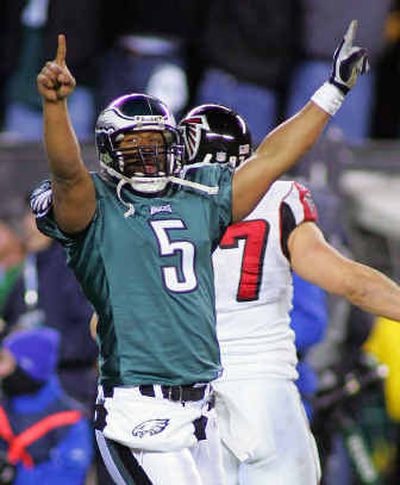 
Philadelphia quarterback Donovan McNabb reacts after throwing a 2-yard touchdown pass in the fourth quarter on Sunday. 
 (Associated Press / The Spokesman-Review)