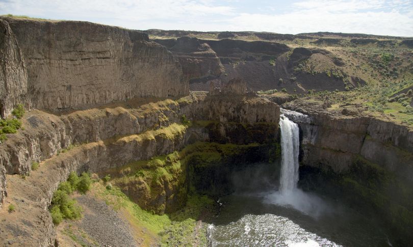 Palouse Falls, a spectacular water fall near Washtucna, Washington, is a popular but remote destination for visitors and campers. (Jesse Tinsley / The Spokesman-Review)
