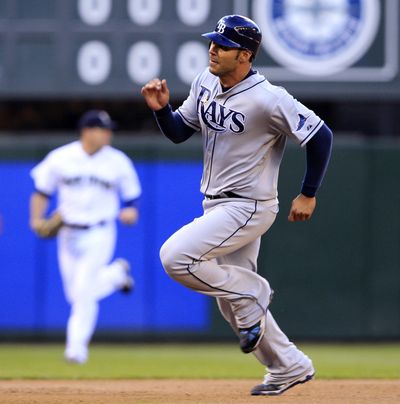 Rays’ Carlos Pena heads home on a double by B.J. Upton in second.   (Associated Press)