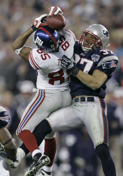 Giants receiver David Tyree (85) made one of the most memorable plays in Super Bowl history four years ago, making a catch over New England’s Rodney Harrison. (Associated Press)