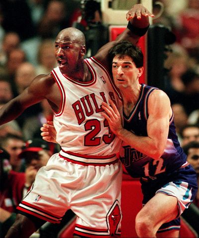 Chicago Bulls’ Michael Jordan and Utah Jazz guard John Stockton vie for position during the first quarter of their game at the United Center on Jan. 25, 1998. (PHIL VELASQUEZ / TNS)