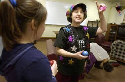 
Ellen Weissman teaches kids, including Lacey Moran, 12, juggling at an after-school meeting at the Sandpoint Youth Center. 
 (Jesse Tinsley photos/ / The Spokesman-Review)