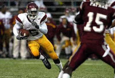 
Tailback Reggie Bush, shown against WSU in October, gave USC an average of 10 yards whenever he touched the ball. 
 (File/ / The Spokesman-Review)