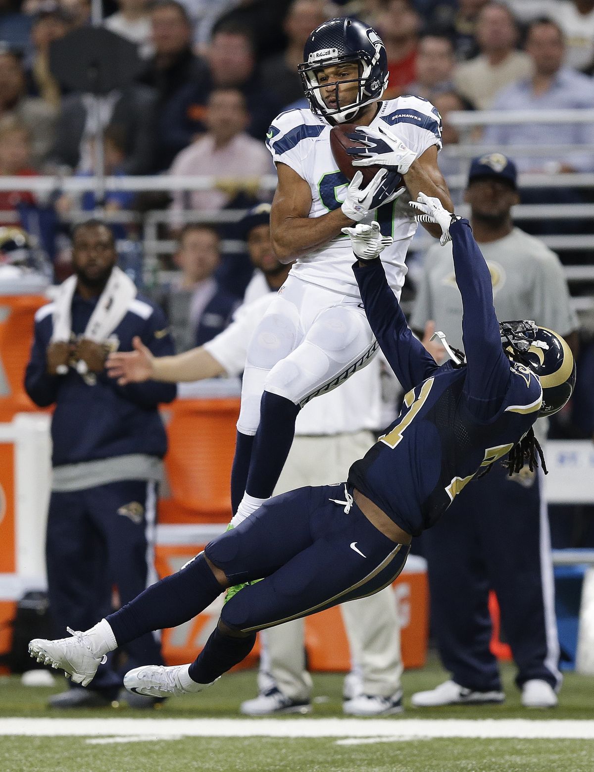Seahawks wide receiver Golden Tate found the end zone on an 80-yard pass play against St. Louis Rams cornerback Janoris Jenkins. (Associated Press)