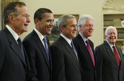 George H.W. Bush, Barack Obama, George W. Bush, Bill Clinton and Jimmy Carter pose  in the Oval Office of the White House on Wednesday.  (Associated Press / The Spokesman-Review)