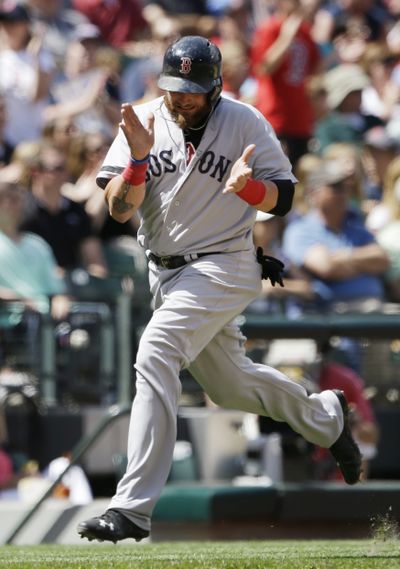Boston’s Jonny Gomes applauds as he rounds third base on his way to scoring in the fifth inning. (Associated Press)