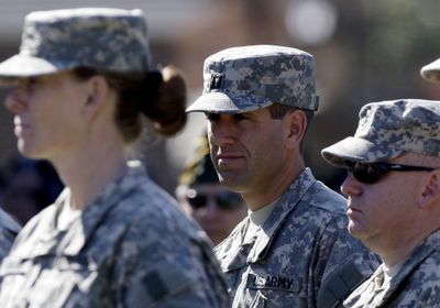Delaware Attorney General Beau Biden, center, stands with other members of his Army National Guard unit  Friday.  (Associated Press / The Spokesman-Review)