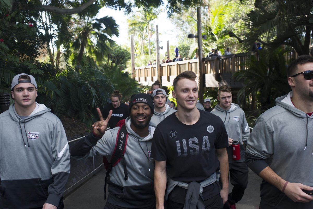 Injured WSU wide receiver River Cracraft and cornerback Marcellus Pippins enter the San Diego Zoo for a a tour with teammates before the 2016 Holiday Bowl on Sunday, Dec. 25, 2016, at The San Diego Zoo in San Diego, Calif. (Tyler Tjomsland / The Spokesman-Review)