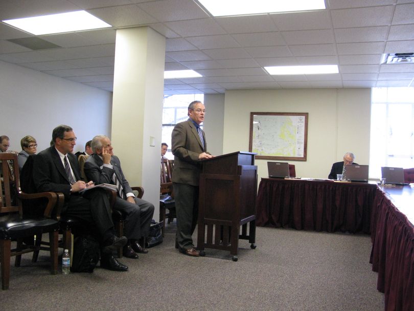 Wally Huffman, general manager of the Sun Valley Resort for the past 42 years, testifies to the Senate State Affairs Committee on Friday on a city consolidation bill, as Sun Valley City Council President Nils Ribi, left, and Sun Valley Mayor Wayne Willich look on. After the hearing, an angry Huffman had to be restrained by Capitol Annex security after he menaced a reporter. (Betsy Russell / The Spokesman-Review)