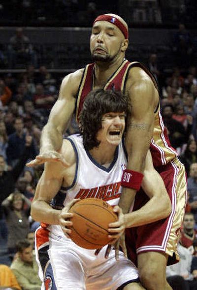 Bobcat's Adam Morrison is fouled by Cavs' Drew Gooden. 
 (Associated Press / The Spokesman-Review)