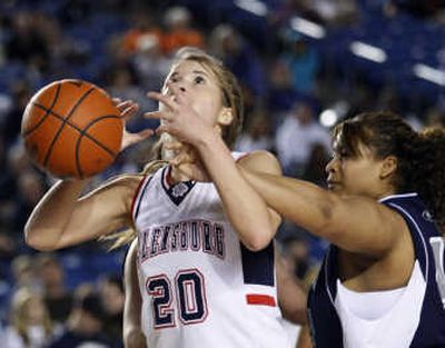 
Ellensburg's Deaira Gordon is fouled by River Ridge's Marlette Evans in 2A title game. River Ridge won 43-42. Associated Press
 (Associated Press / The Spokesman-Review)