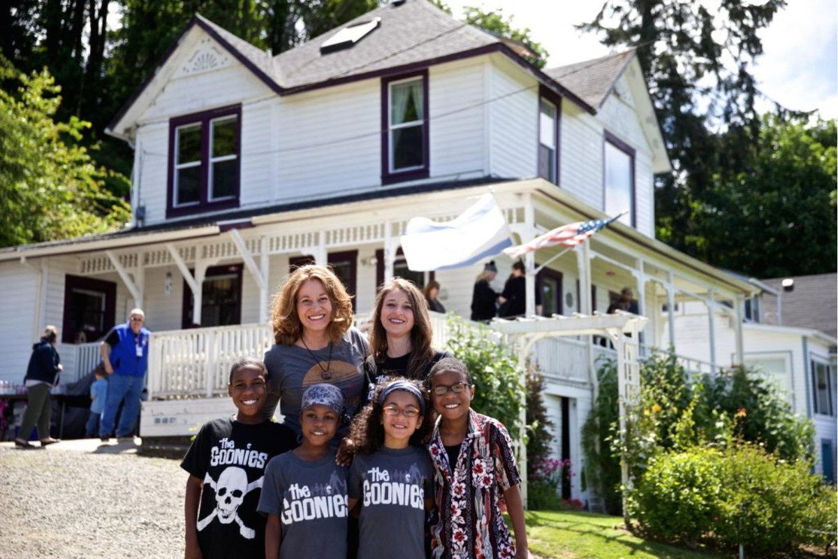 This June 2014 photo shows Devonte Hart with his family at the annual celebration of "The Goonies" movie in Astoria, Ore. Authorities in Northern California say they believe all six children from a family were in a vehicle that plunged off a coastal cliff. Greg Baarts, acting assistant chief of the California Highway Patrol’s northern division, told NBC affiliate KGW8 on Sunday that investigators have “reason to believe ... that the crash was intentional.” (Thomas Boyd / Oregonian)