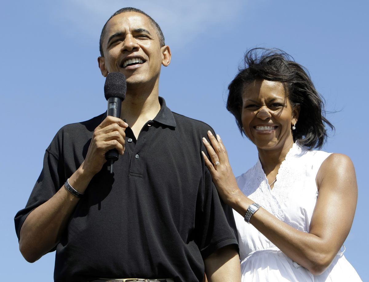 This Aug 8, 2008 file photo shows then Democratic presidential candidate Sen. Barack Obama, D-Ill., with his wife Michelle Obama, speaking at a welcome to Hawaii rally at Keehi Lagoon Beach Park in Honolulu, Hawaii. Associated Press file photos (Associated Press file photos / The Spokesman-Review)