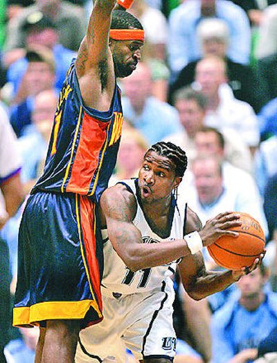 
Utah and Dee Brown, right, found way around Warriors. 
 (Associated Press / The Spokesman-Review)