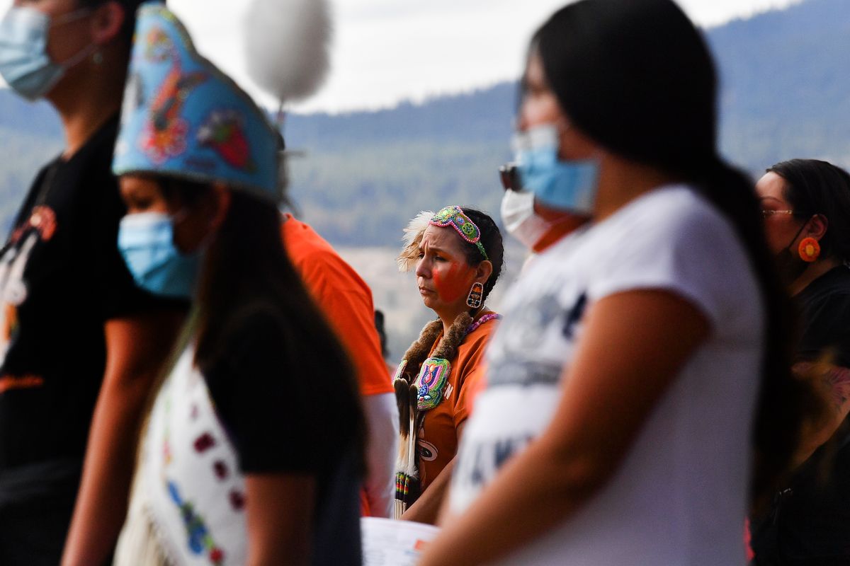 Anne Tak Pee Ford reacts during a moment of silence Thursday held at an event honoring the lives of those lost in Indian boarding schools at the Fort Spokane Visitor Center near Davenport, Wash.  (Tyler Tjomsland/The Spokesman-Review)