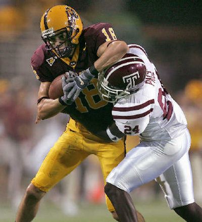 
Temple defensive back Chris Page corrals Arizona State receiver Moey Mutz during first-half action on Thursday.
 (Associated Press / The Spokesman-Review)