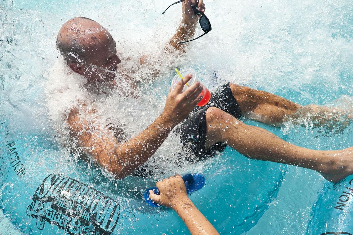 A Boulder Beach Water Park visitor gets doused at Silverwood Theme Park in Athol, Idaho, on Friday, August 10, 2018. Silverwood announced Tuesday it will be reopening along with its water park in May 30 for the 2020 season. (Kathy Plonka / The Spokesman-Review)