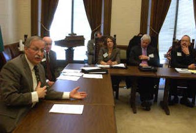 
House Speaker Frank Chopp, left, speaks to dozens of Spokane area business and community leaders at the state Capitol on Thursday. 
 (RICHARD ROESLER / The Spokesman-Review)