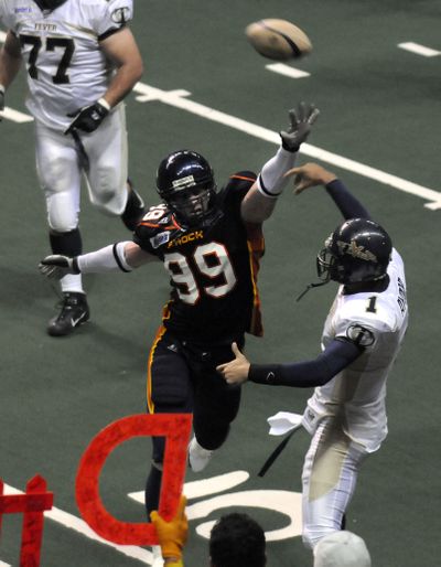 Ben McCombs puts pressure on Tri-Cities QB Joe Ayoob.   (CHRISTOPHER ANDERSON / The Spokesman-Review)