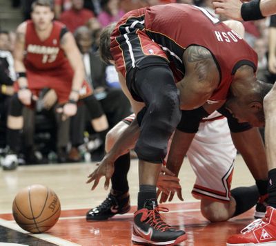 Miami forward Chris Bosh loses control of the ball during the second quarter Thursday. (Associated Press)