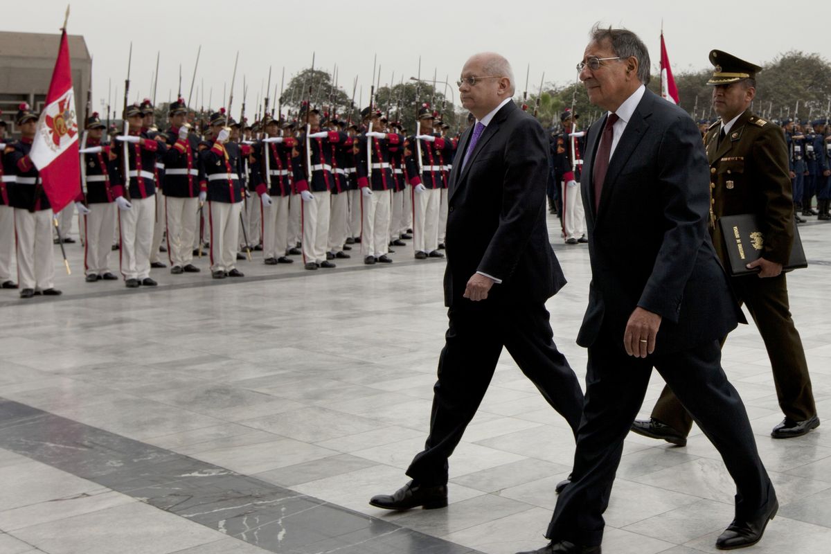 U.S. Defense Secretary Leon Panetta, right, walks with Peru