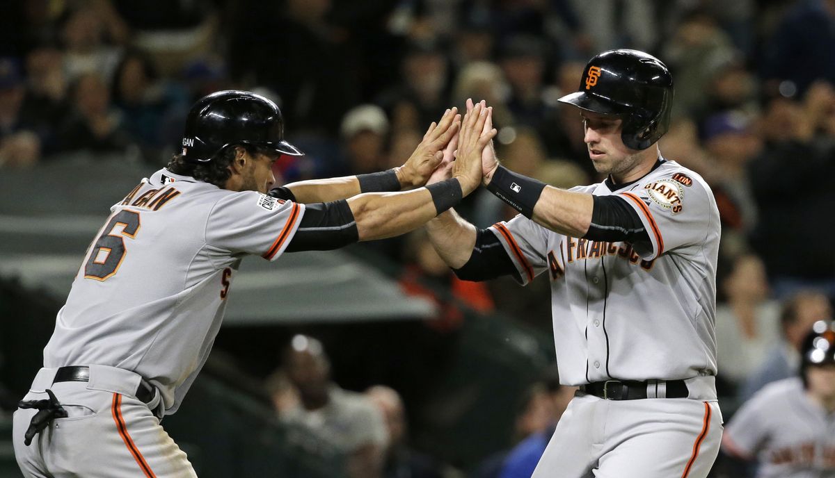 San Francisco’s Angel Pagan, left, and Buster Posey scored on a triple by Matt Duffy in the eighth inning. (Associated Press)