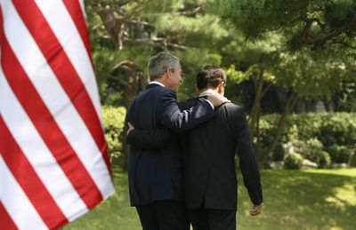 President Bush and South Korean President Lee Myung-bak leave the podium today after a joint press conference outside the Blue House in Seoul, South Korea.  (Associated Press / The Spokesman-Review)
