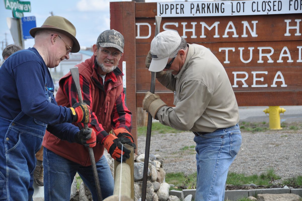 This group of workers built a fence along Appleway during acommunity work project at the Dishman Hills Natural Area on Saturday, April 9, 2011. More than 330 people volunteered to help. The event was sponsored by REI and several outdoor groups.  (Rich Landers)