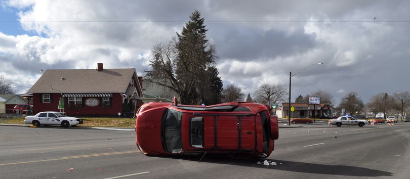 The elderly driver of this SUV was hospitalized after a repeat offender crashed into her during a police case in a stolen Acura. (Spokane Police Department)