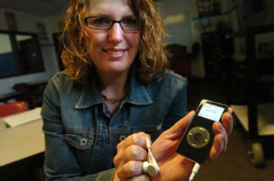
Schoolteacher Tania Johnson holds an iPod digital music player that teen inmates at the Kootenai County Juvenile Detention Center can use for short periods in the classroom as a reward for good behavior. In the strict confines of the juvenile jail, the opportunity to hear music or listen to books on tape is a treat. 
 (Jesse Tinsley / The Spokesman-Review)