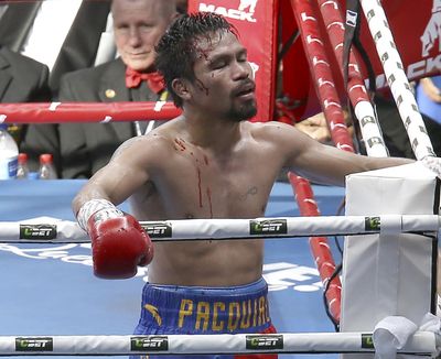 Manny Pacquiao of the Philippines reacts after his loss to Jeff Horn of Australia, during their WBO World Welterweight title fight in Brisbane, Australia, Sunday, July 2, 2017. (Tertius Pickard / Associated Press)