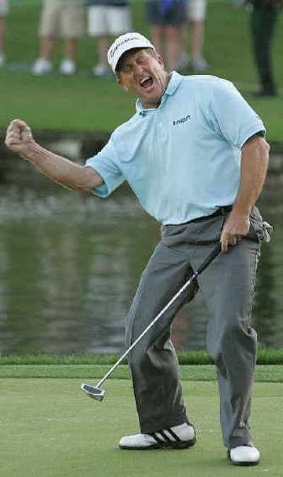 
Fred Funk celebrates after sinking a putt on the 18th hole during Monday's final round of The Players Championship. 
 (Associated Press / The Spokesman-Review)