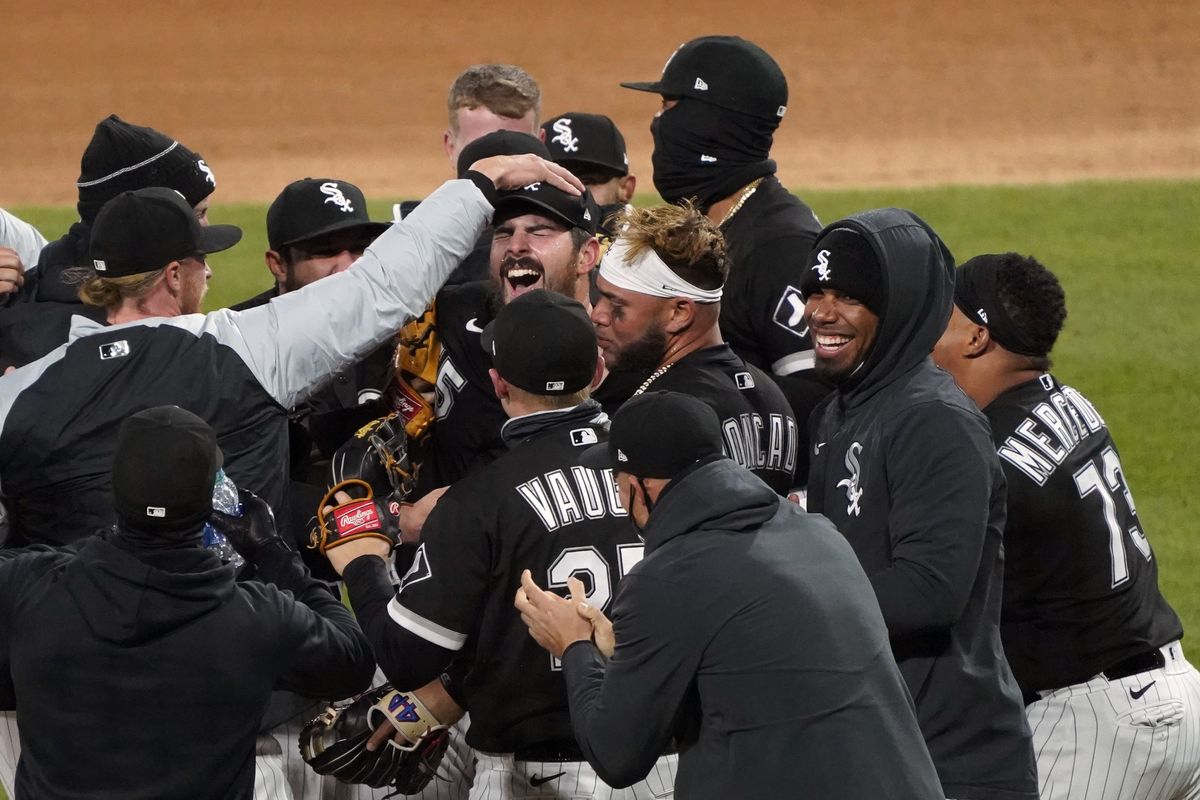 Chicago White Sox starting pitcher Carlos Rodon, center, celebrates his no hitter against the Cleveland Indians with his teammates in a baseball game, Wednesday, April, 14, 2021, in Chicago.  (Associated Press)