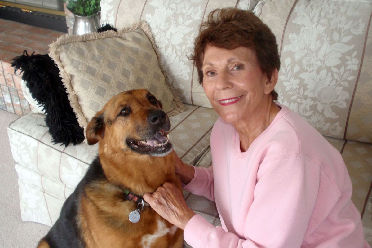 Florence Petheram poses with her dog Samantha in a recent photo at home in Auburn, Wash. She’ll return to Spokane on Saturday for a book signing at Auntie’s.